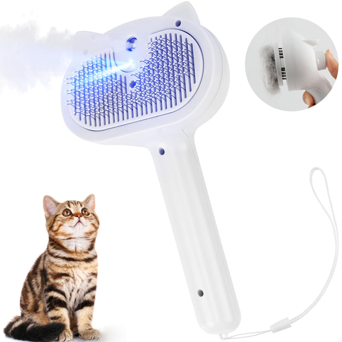 White handheld cat grooming brush with blue bristles and steam feature next to tabby kitten