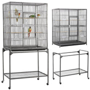 Large wire bird cage with multiple compartments showing parrots inside and matching rolling stand