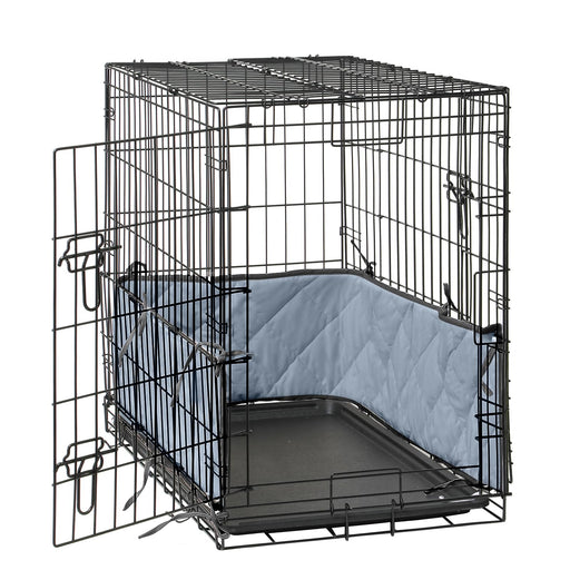 Black wire dog crate with open door showing blue quilted bumper pad inside on plastic tray