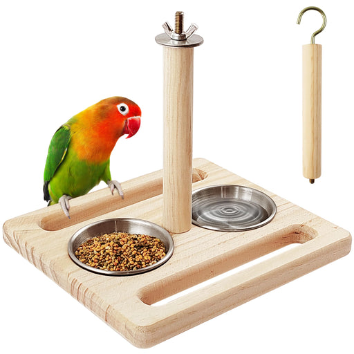 Lovebird perched on wooden stand with two stainless steel feeding bowls and hook accessory