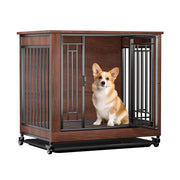 Corgi sitting inside wooden mobile dog crate with metal bars and wheels on white background