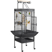 Large wrought iron parrot cage with open door showing colorful birds perched inside on stand