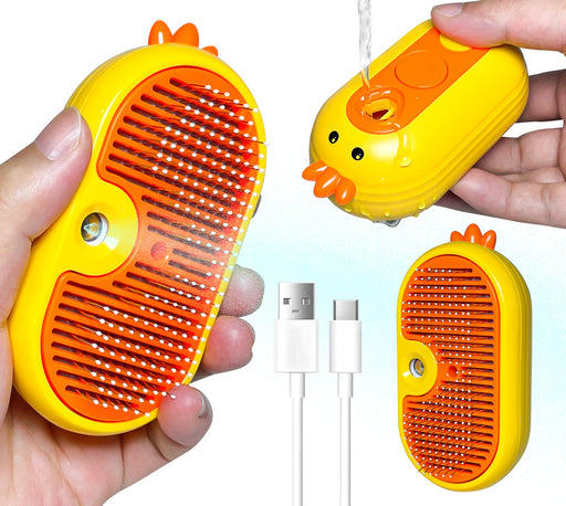 Yellow chicken-shaped 3-in-1 steam cat grooming brush held in hands showing orange bristles and