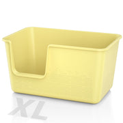 Yellow plastic cat litter box with high sides and textured bottom shown at an angle